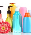 bottles of health and beauty products on white background