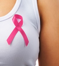 Pink Badge On Woman Chest To Support Breat Cancer Cause