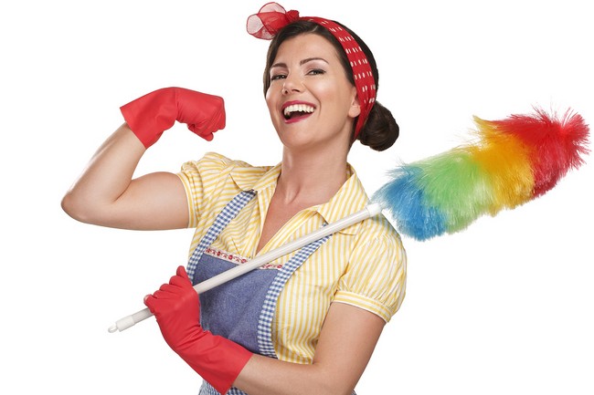 young happy beautiful woman maid dusting on white background