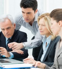 Business People Working Together On A Laptop