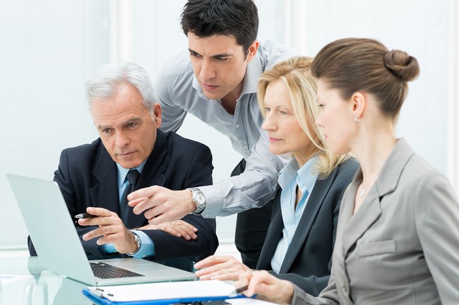 Business People Working Together On A Laptop