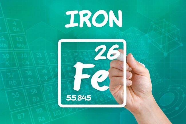 Hand drawing the symbol for the chemical element iron
