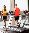 Group of people running on treadmills