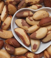 Brazil nut, healthy food ingredient in heart shaped tray