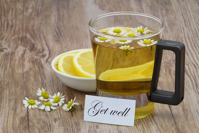 Get well card, chamomile tea and fresh lemon