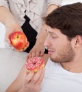 Man Choosing Donut Instead Of Apple