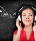 Music - woman wearing headphones listening to music with music n