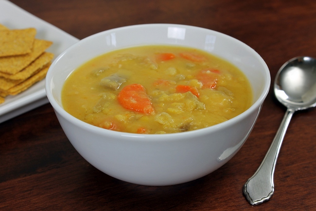 Vegetarian/vegan Yellow Split Pea Soup With Crackers And Spoon