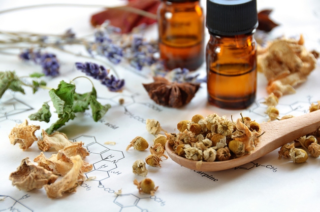 herbs and essential oils on science sheet