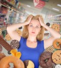 Diet Woman At Grocery Store With Junk Food