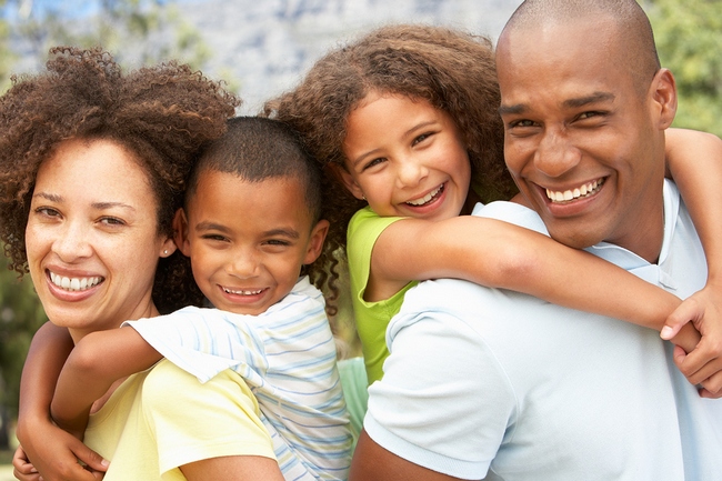 Portrait of Happy Family In Park