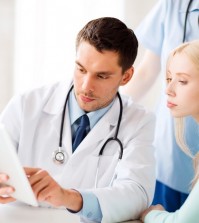 healthcare, medical and technology - doctor showing something pa