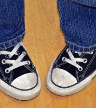 pigeon-toed teen in sneakers